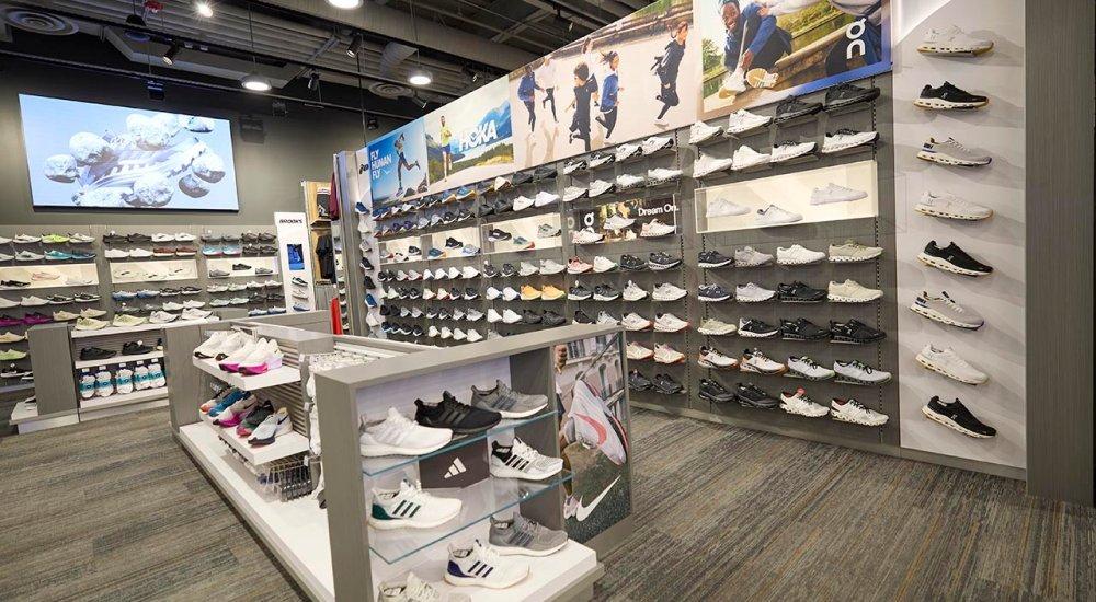 Wall full of shoes and a center row of more shoes